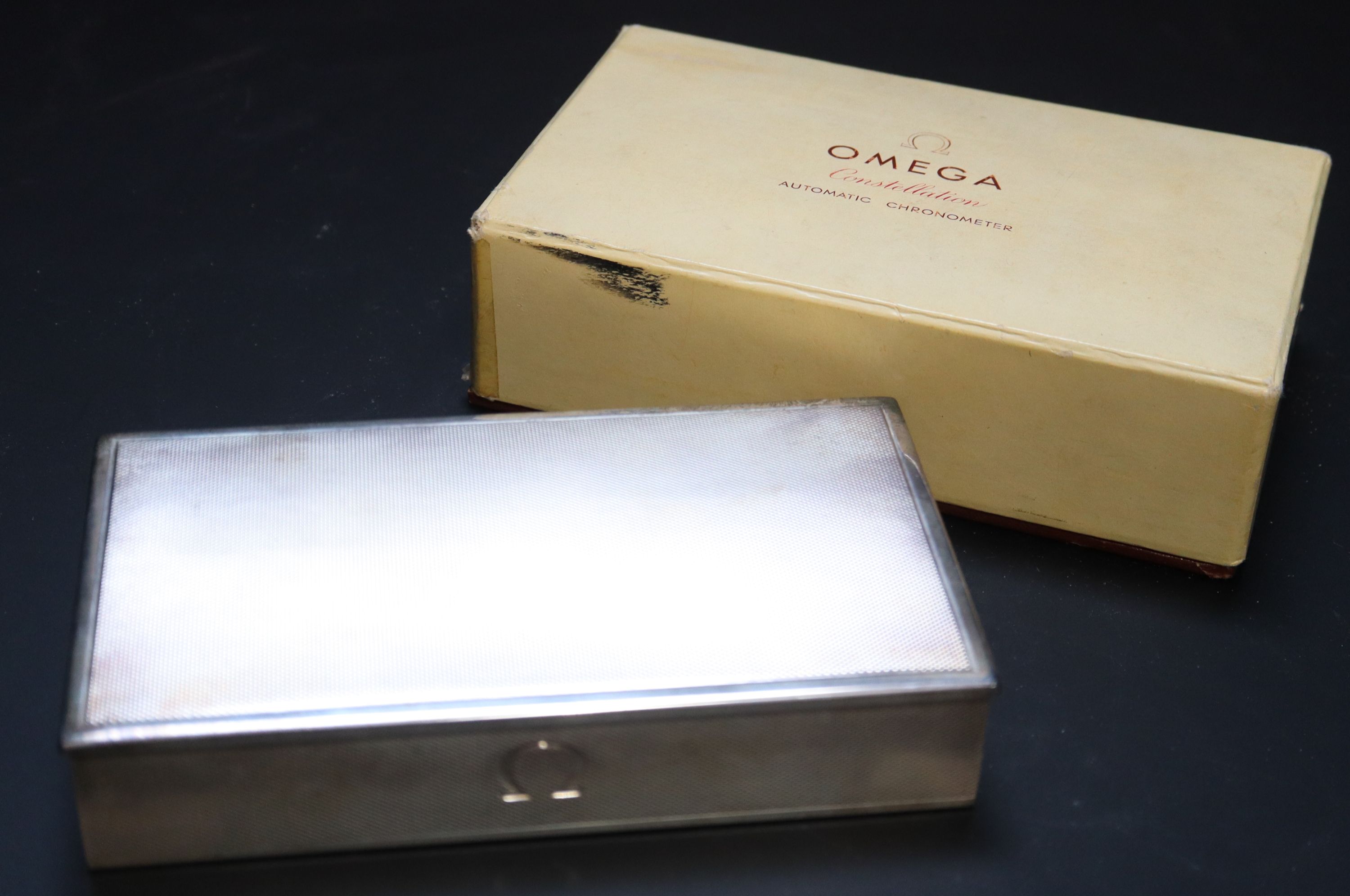 An engine turned sterling 925 mounted rectangular Omega Constellation wrist watch box (no watch),